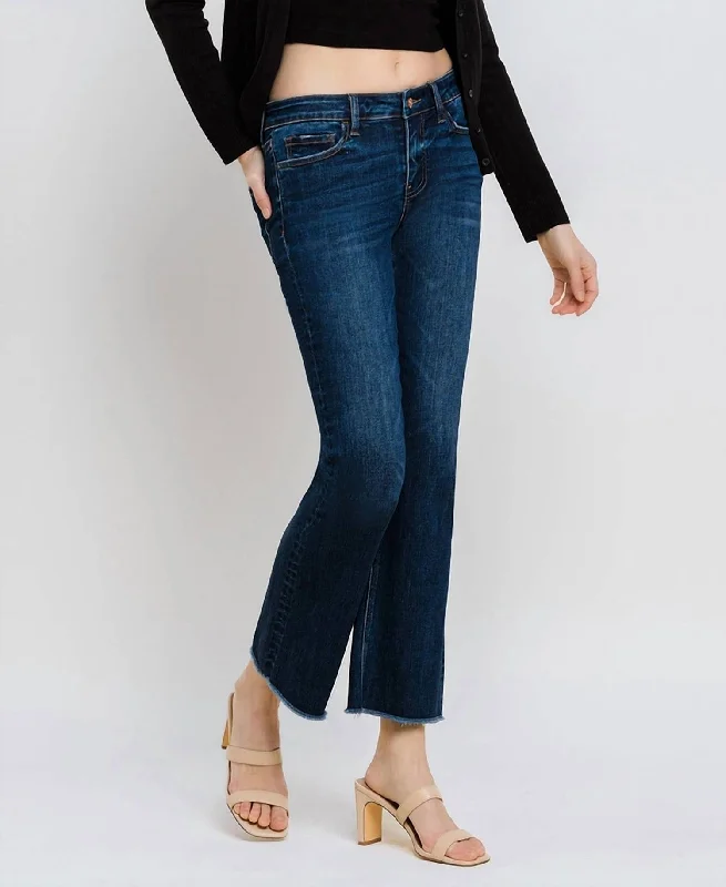 Mid Rise Raw Hem Kick Flare Jeans In Dark Wash